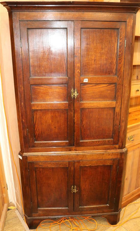 An oak corner cabinet, W.94cm